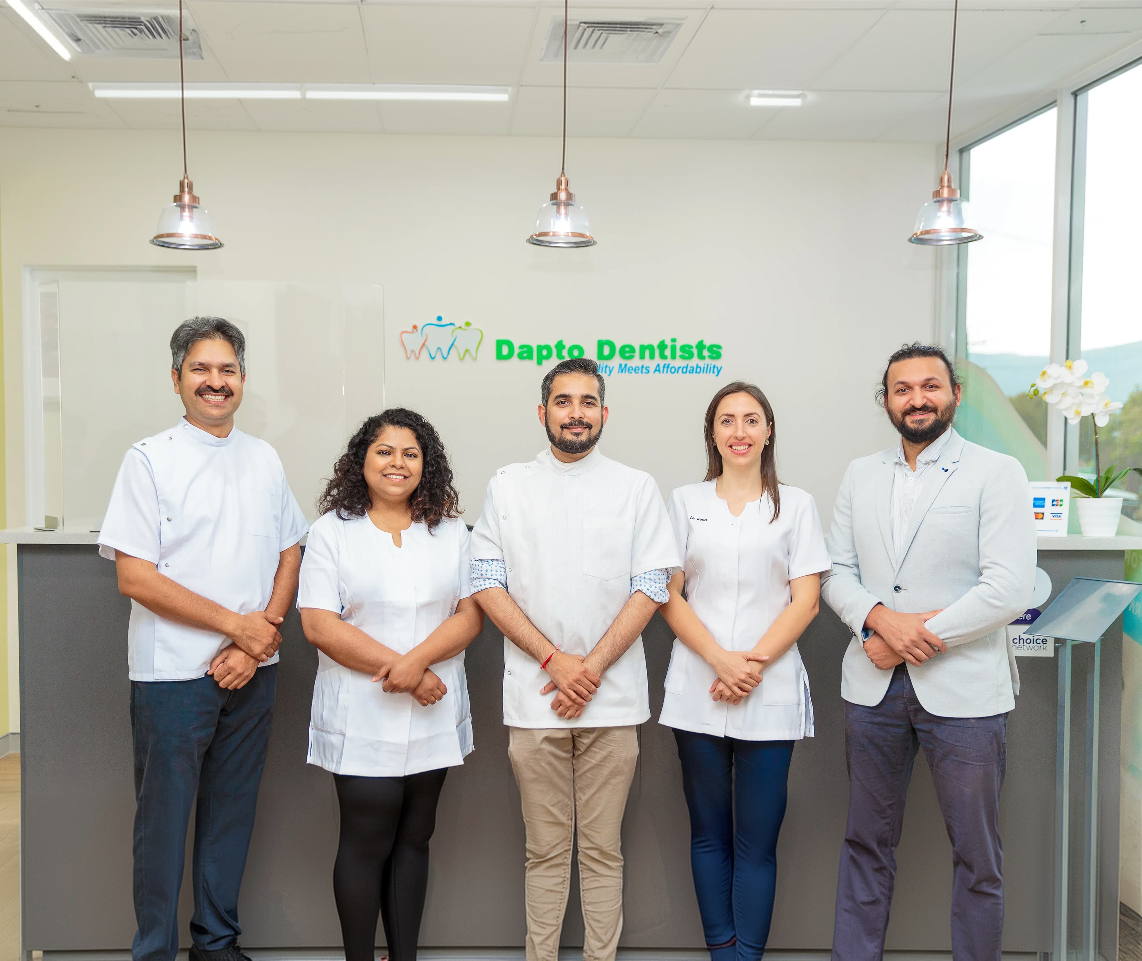 The Dapto Dentists team standing together in the clinic.