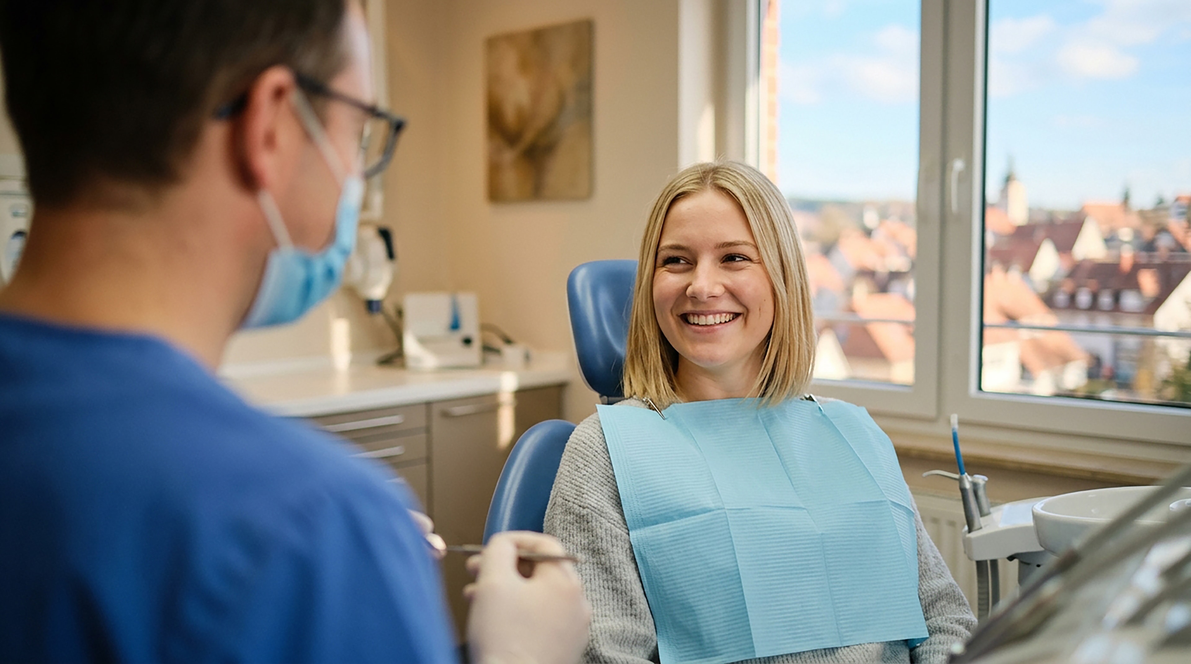 A Dapto dentist and dental assistant speaking with a patient in the clinic.