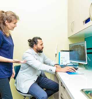 A Dapto dentist speaking with a patient in the clinic.