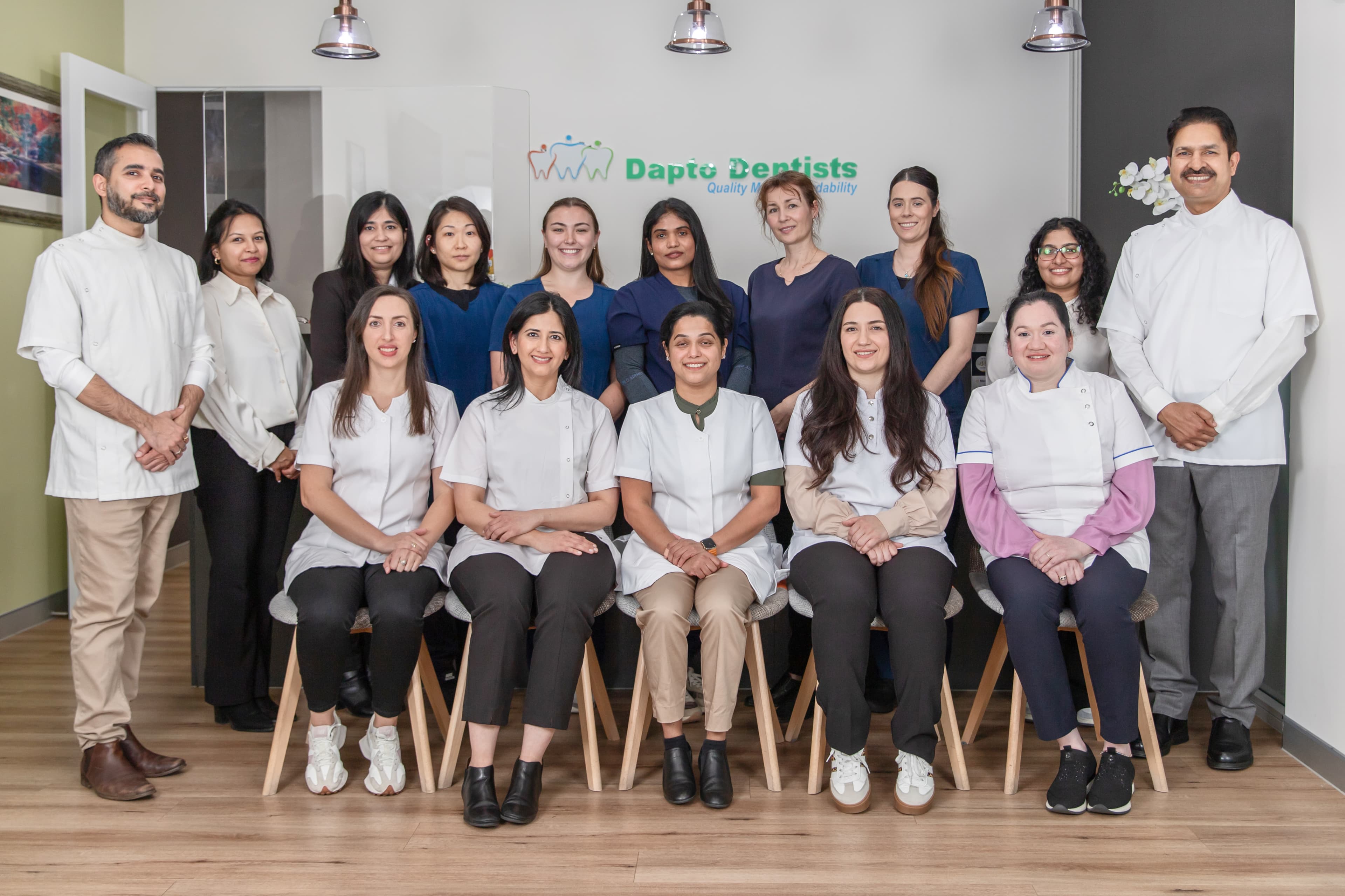 Dental team members standing together inside a clinic.