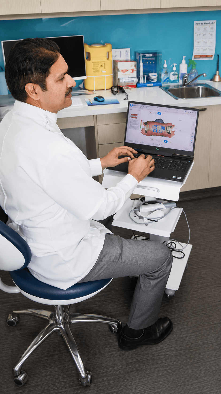 A dentist and patient discussing dental care in a consultation room.